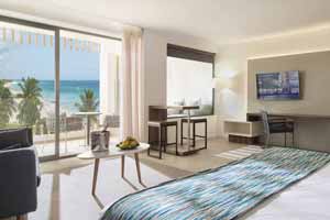 majestic mujeres costa elegance suite bedroom cancun bed features sofa